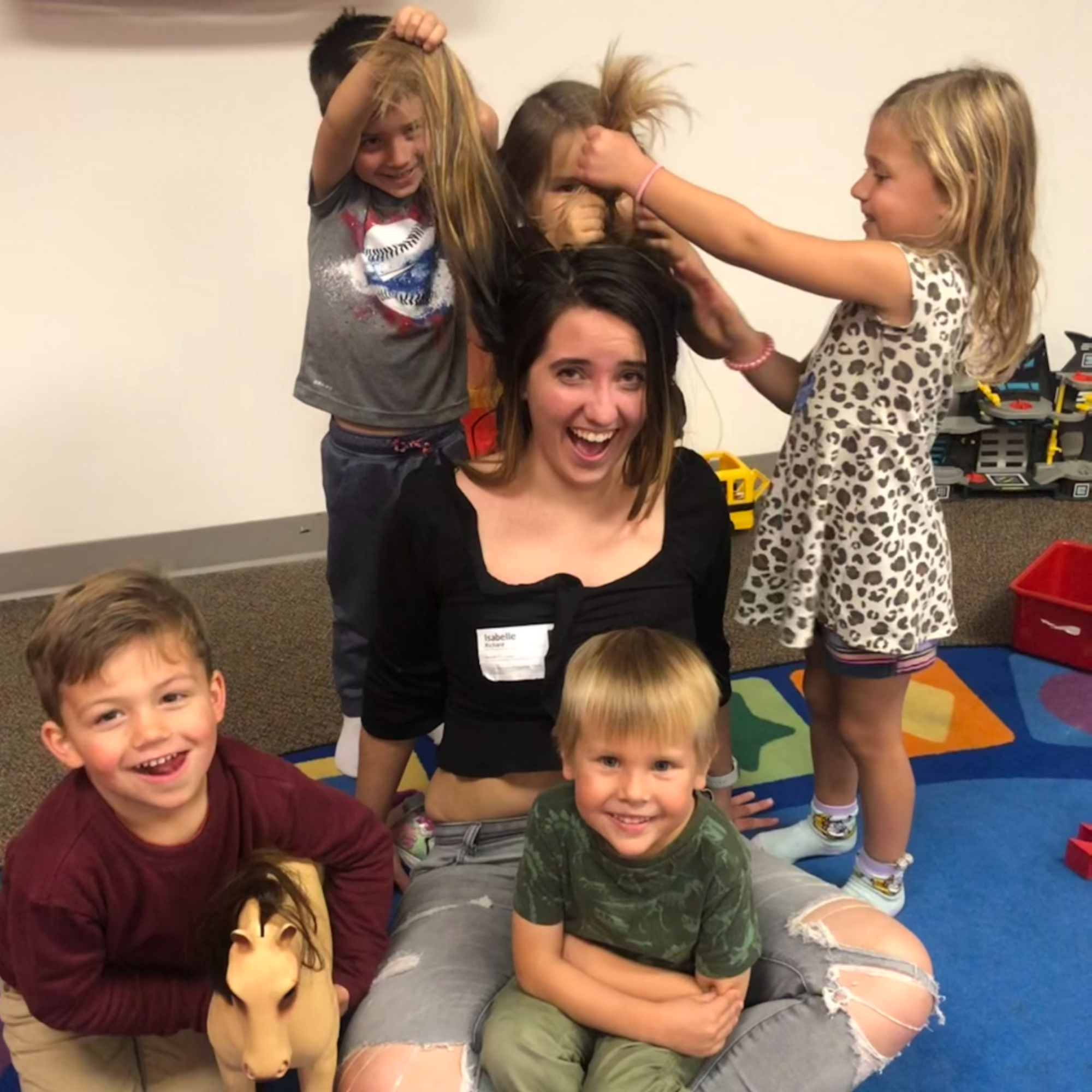 Isabelle serving with kids
